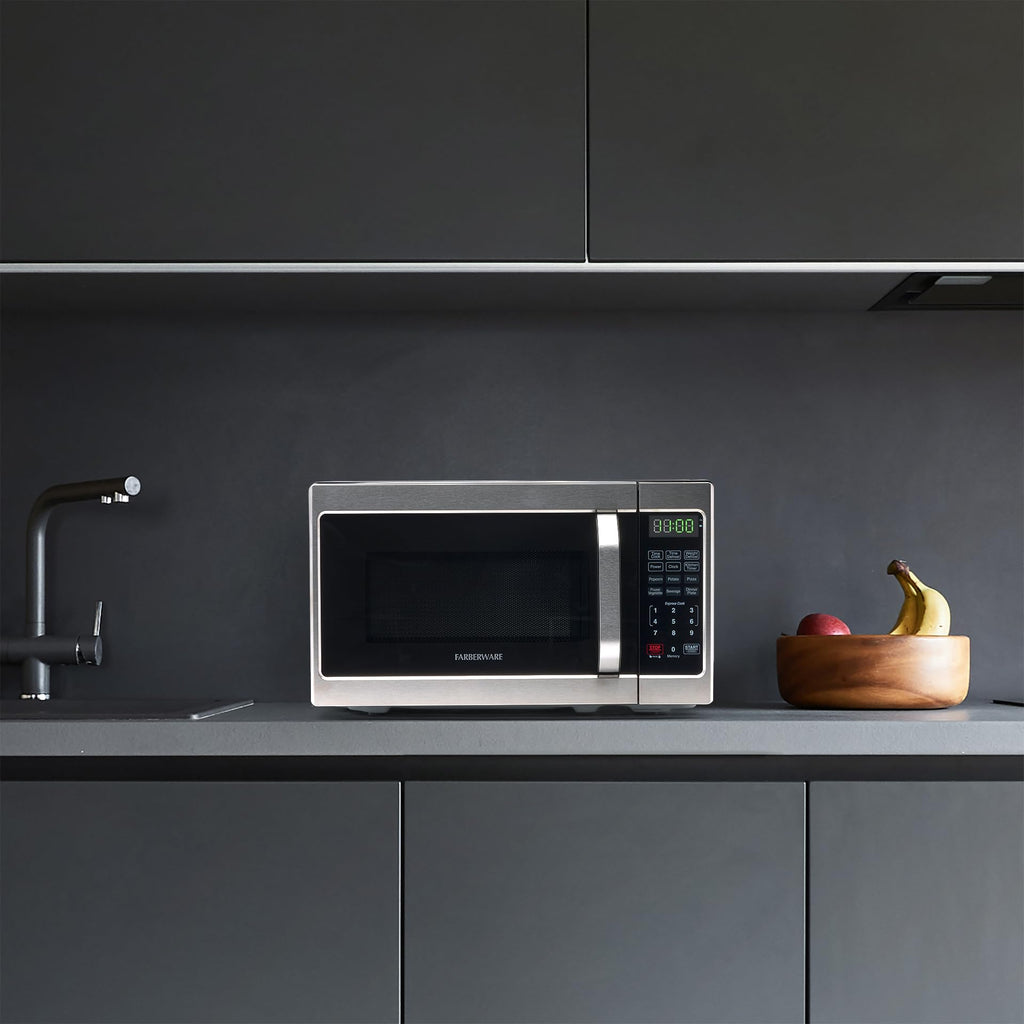 Kuchenka mikrofalowa Farberware Countertop o mocy 700 W, 0,7 stopy sześciennej - kuchenka mikrofalowa z oświetleniem LED i blokadą dziecięcą - idealna do mieszkań i akademików - łatwa do czyszczenia stal nierdzewna