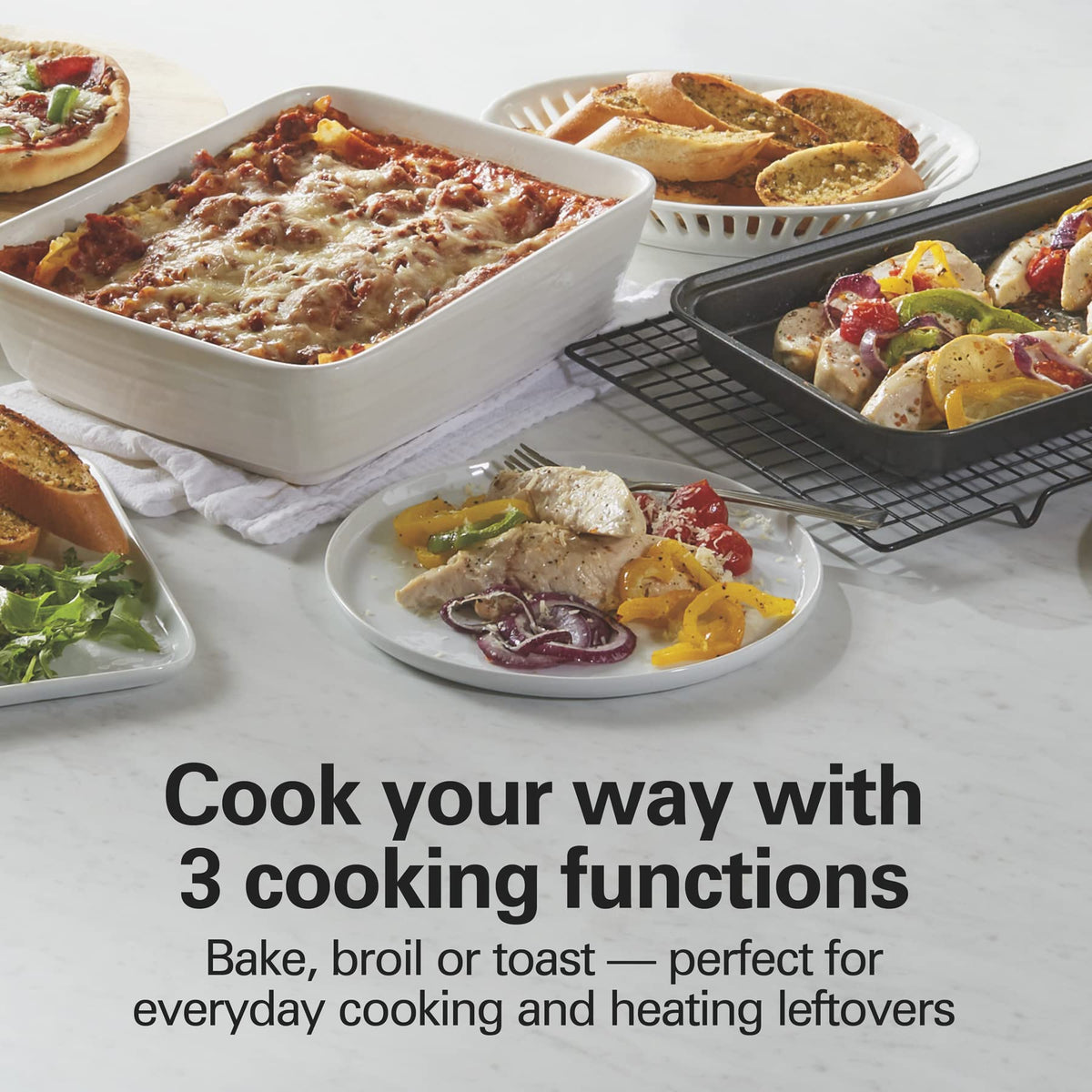 Hamilton Beach Easy Reach 4-Slice Countertop Toaster Oven With Roll-Top Door, 1200 W, Pasuje do pizzy 9”, 3 funkcje pieczenia: pieczenie, grillowanie i tostowanie, Srebrny (31344DA)